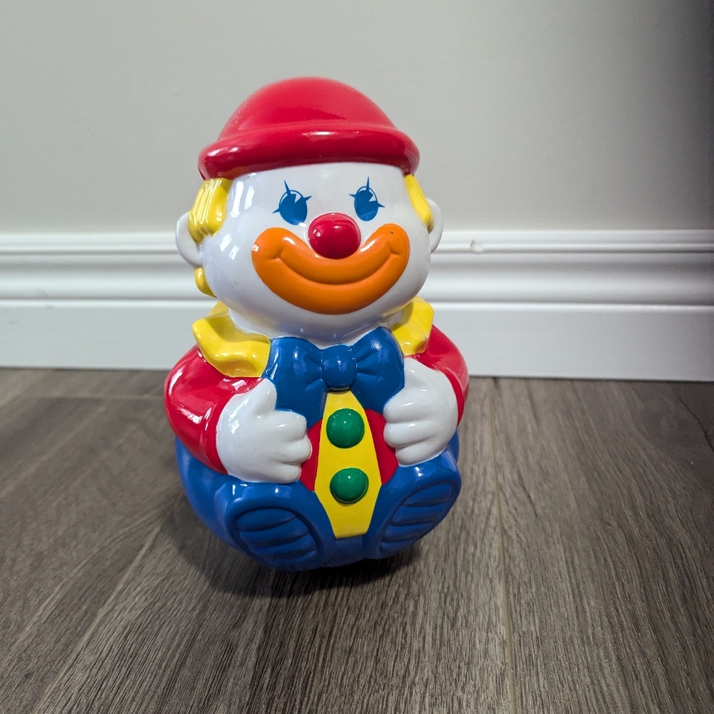Musical and Wobble toy clown .  Plastic. Unbranded. EUC. It jingles when…
